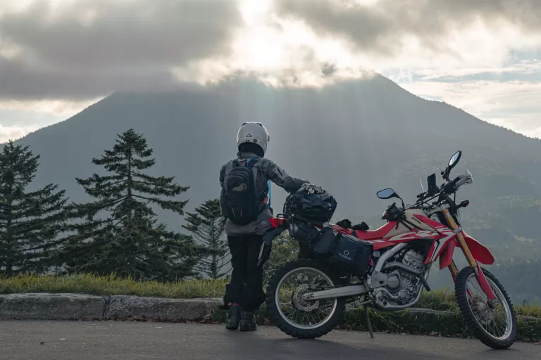 honda motorcycle in front of a mountain in hokkaido